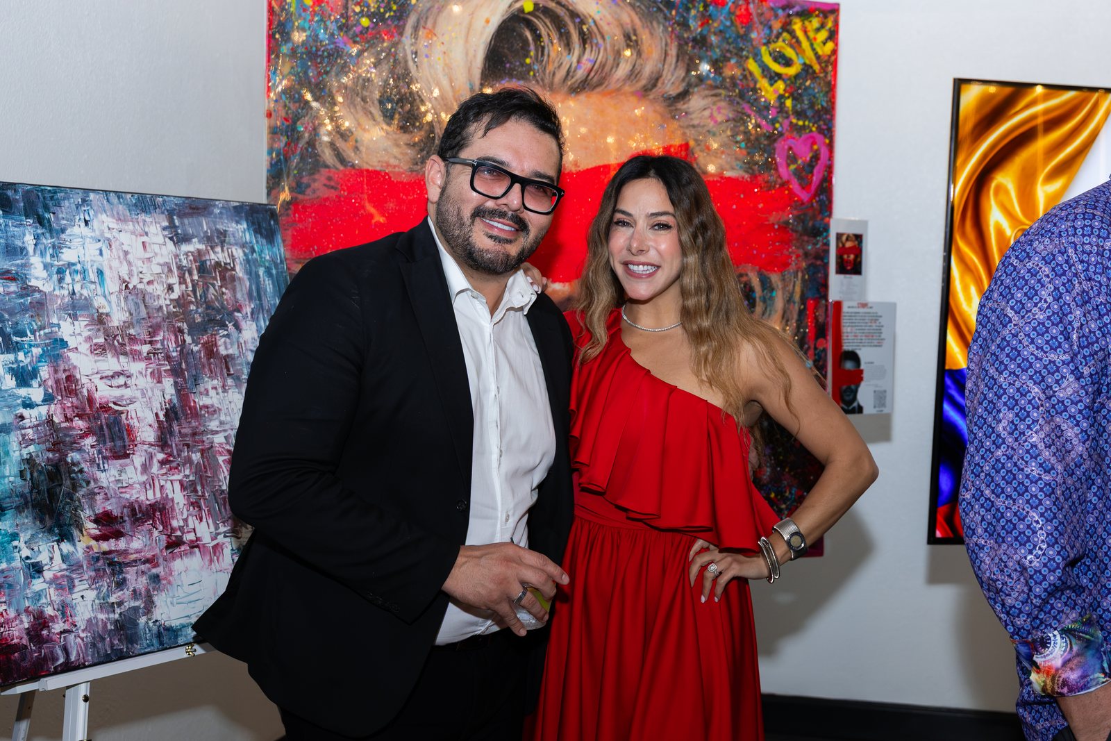 Guests beside the artwork display at Trellis 925