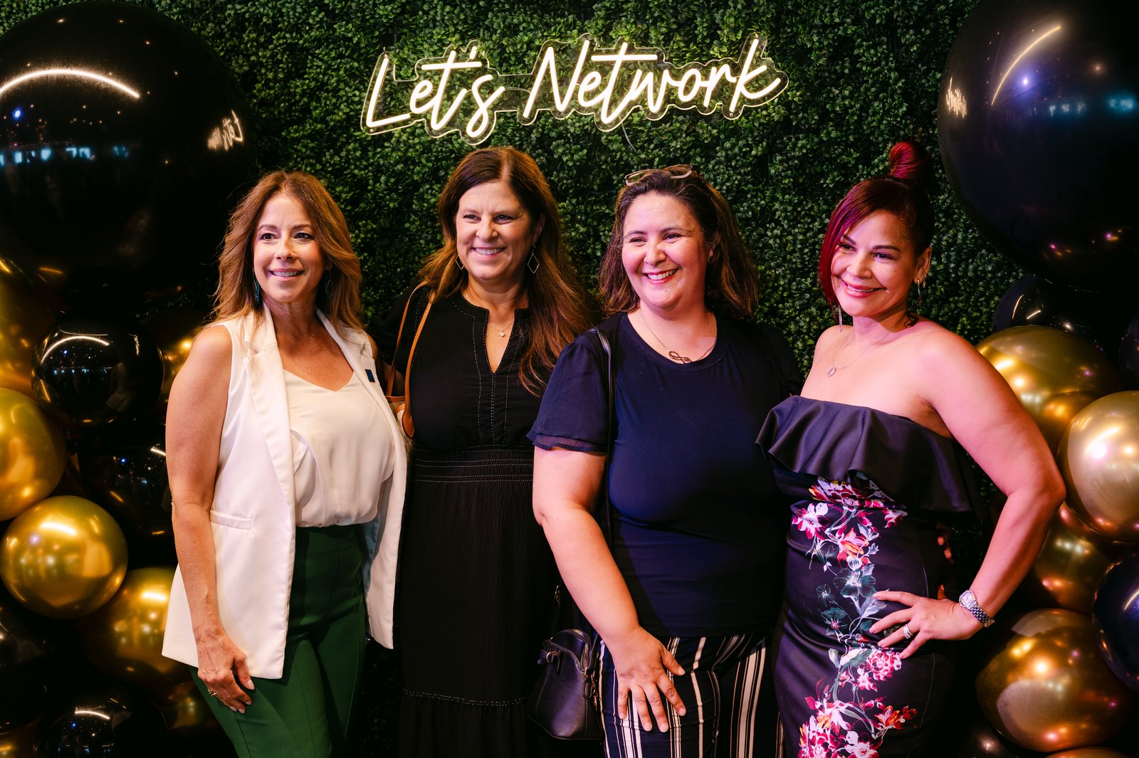 A networking backdrop at a corporate event at Trellis 925