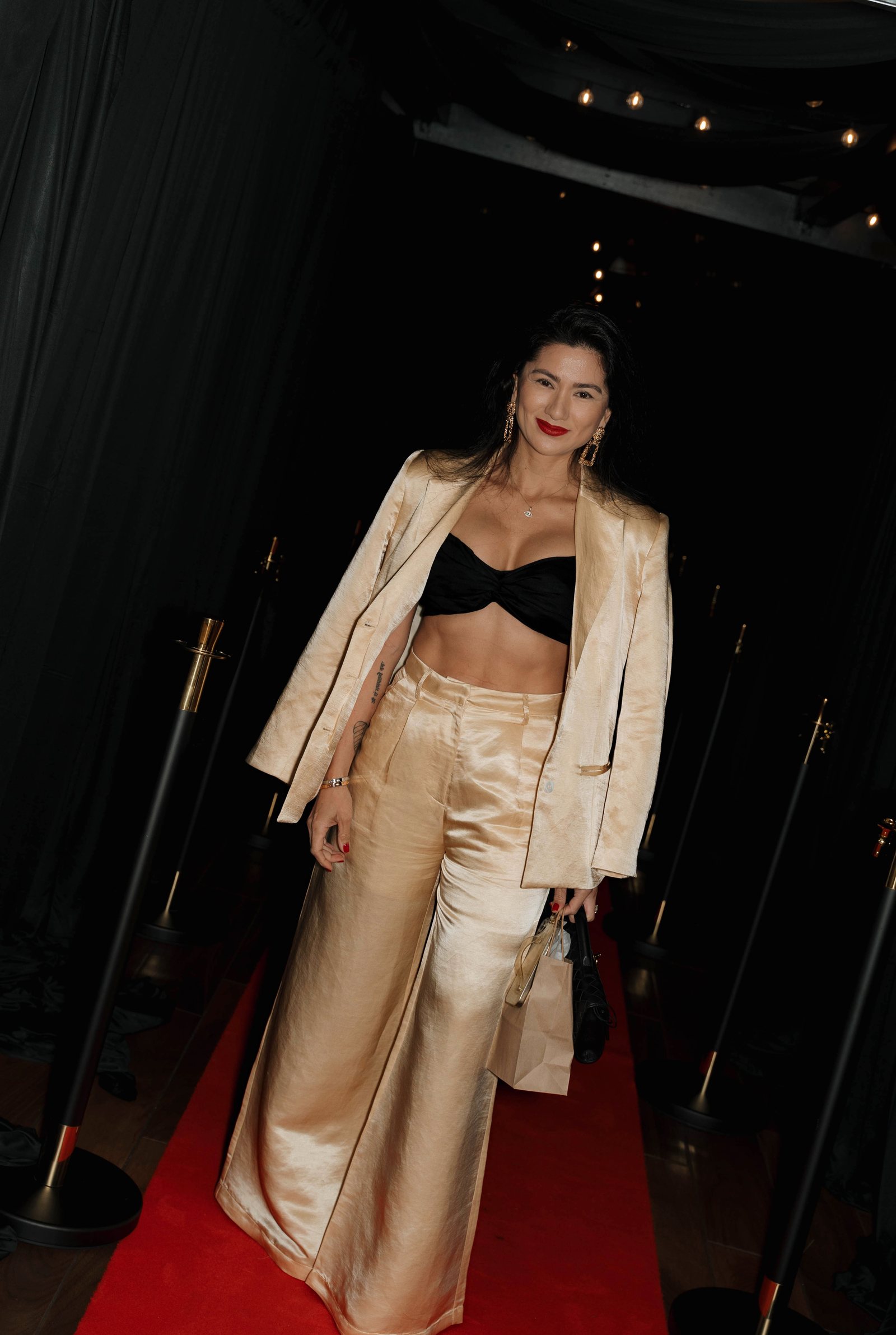 A guest arriving on the red carpet at Trellis 925