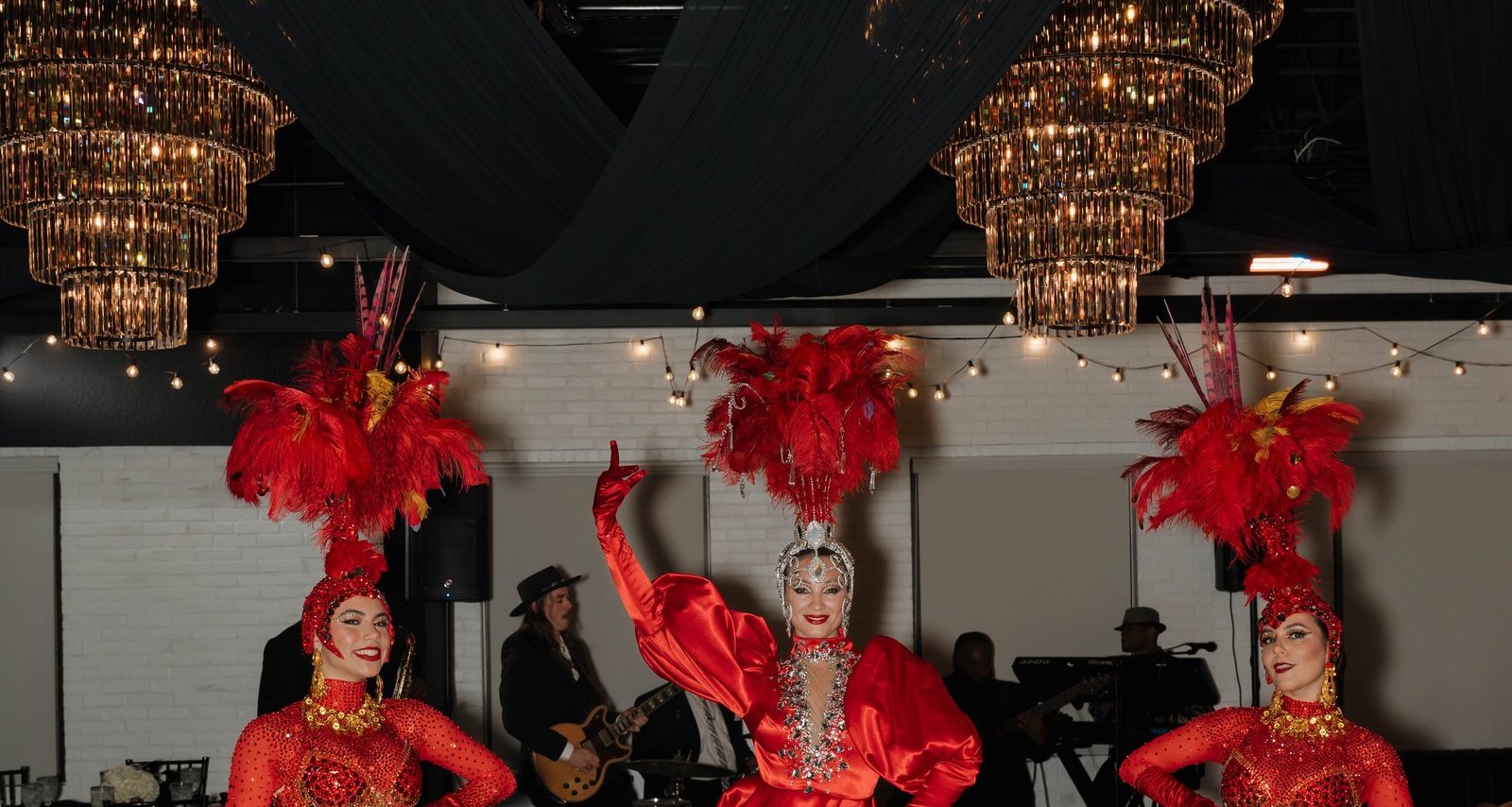 Featured performers beneath the chandeliers at a private celebration at Trellis 925