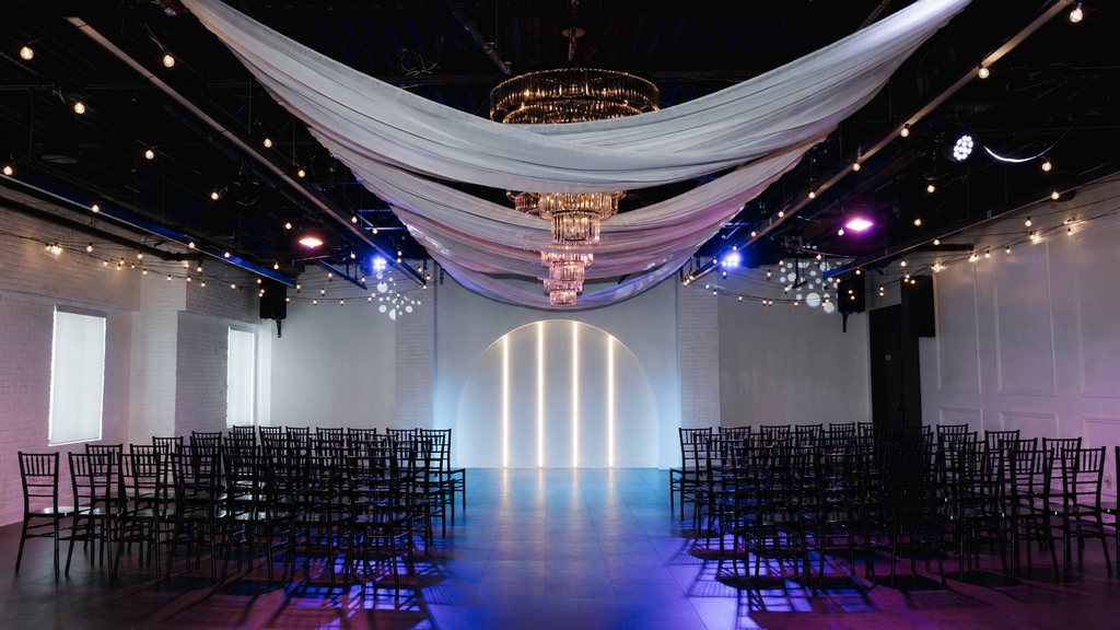 The Trellis 925 main hall set for a ceremony under chandelier light