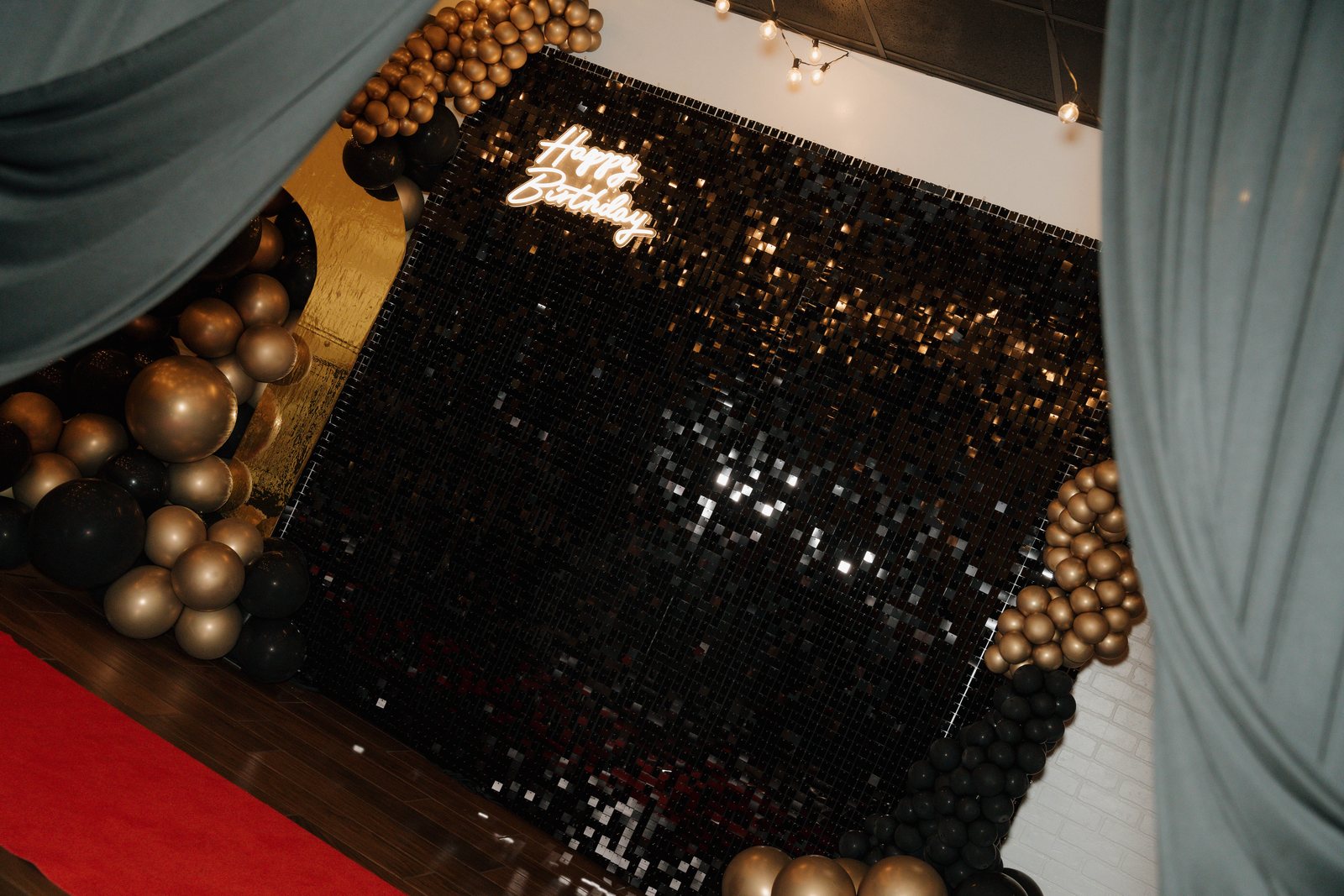 A sequin backdrop and balloon installation at Trellis 925