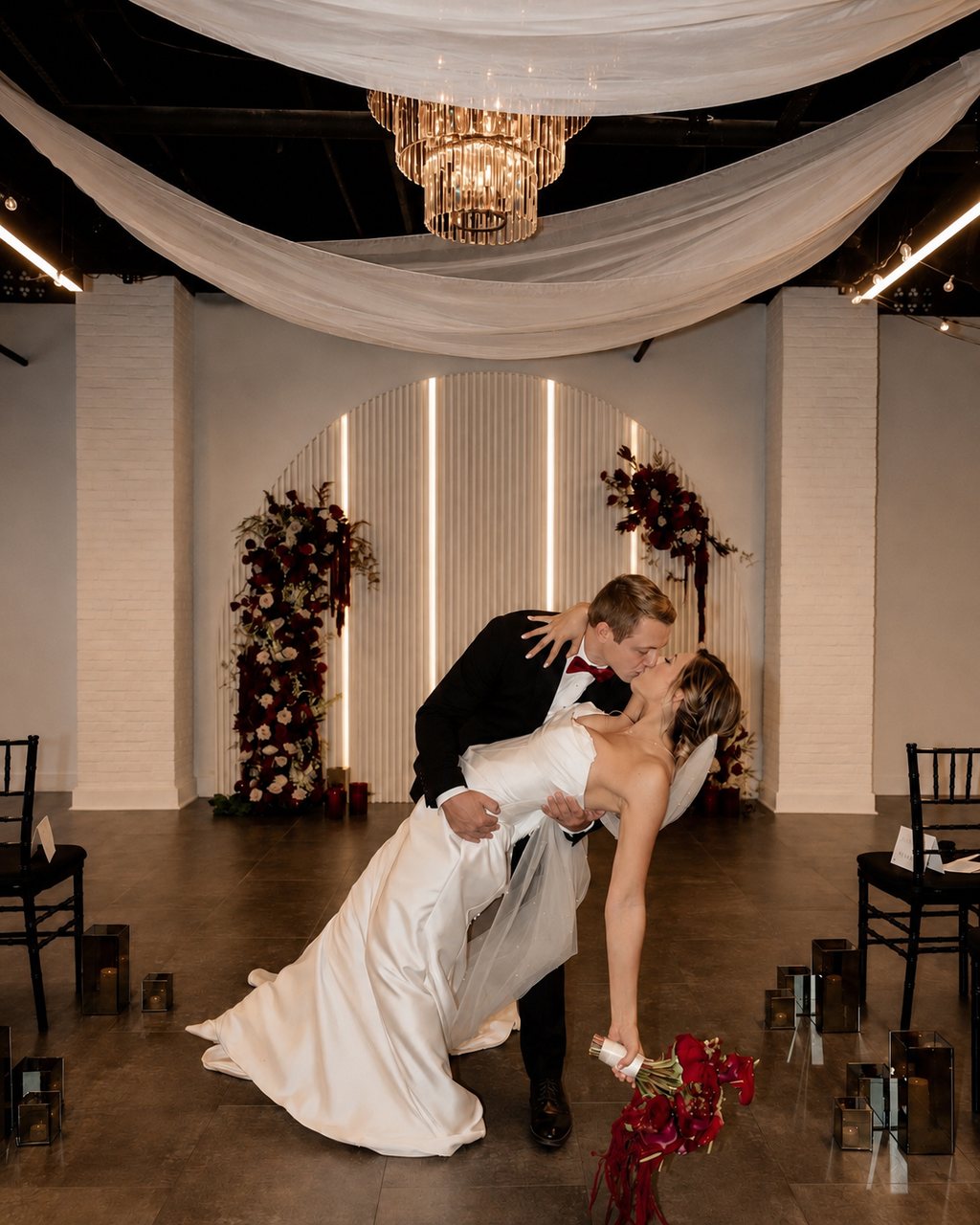 A celebratory kiss after the ceremony at Trellis 925