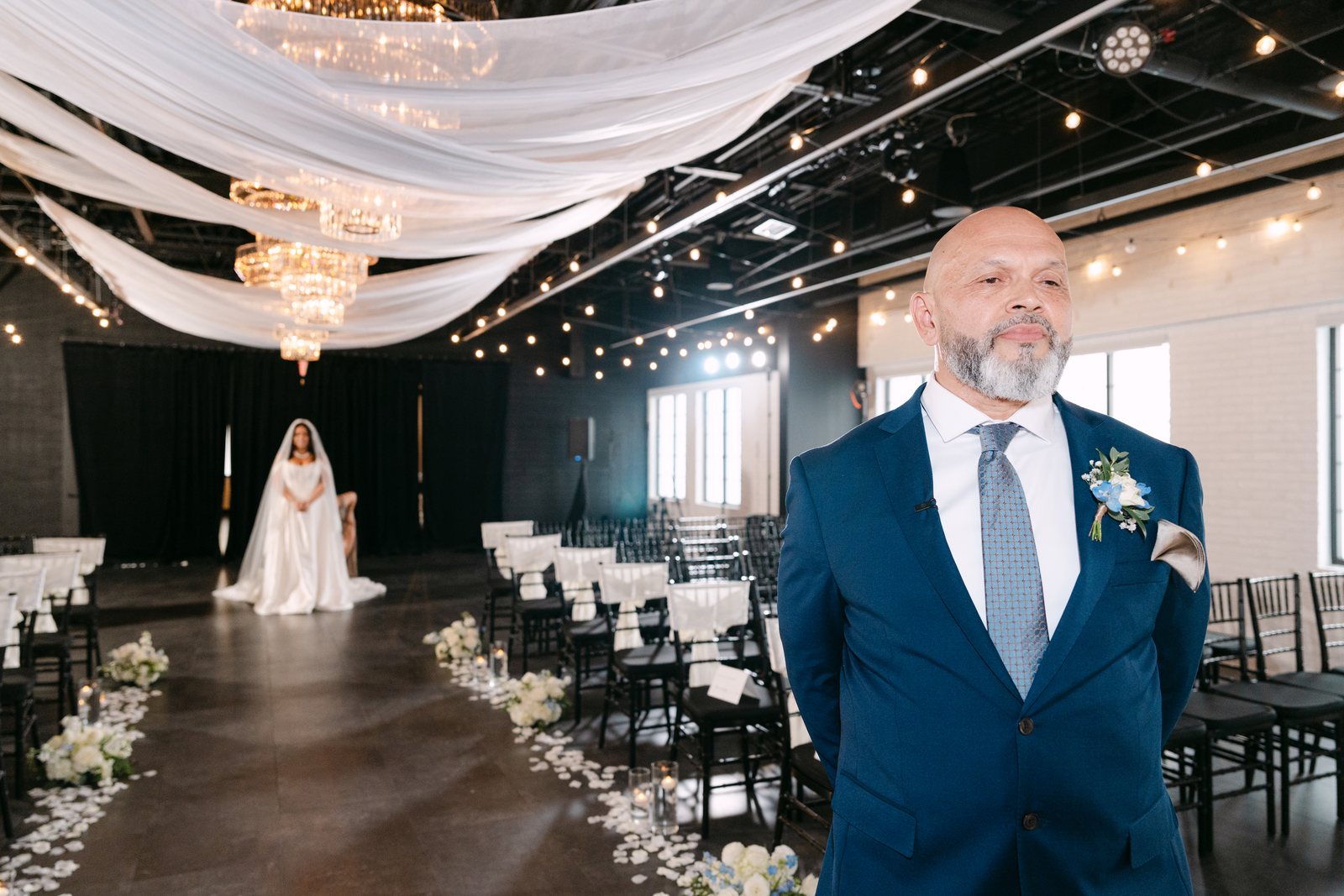 A bride entering the ceremony aisle at Trellis 925
