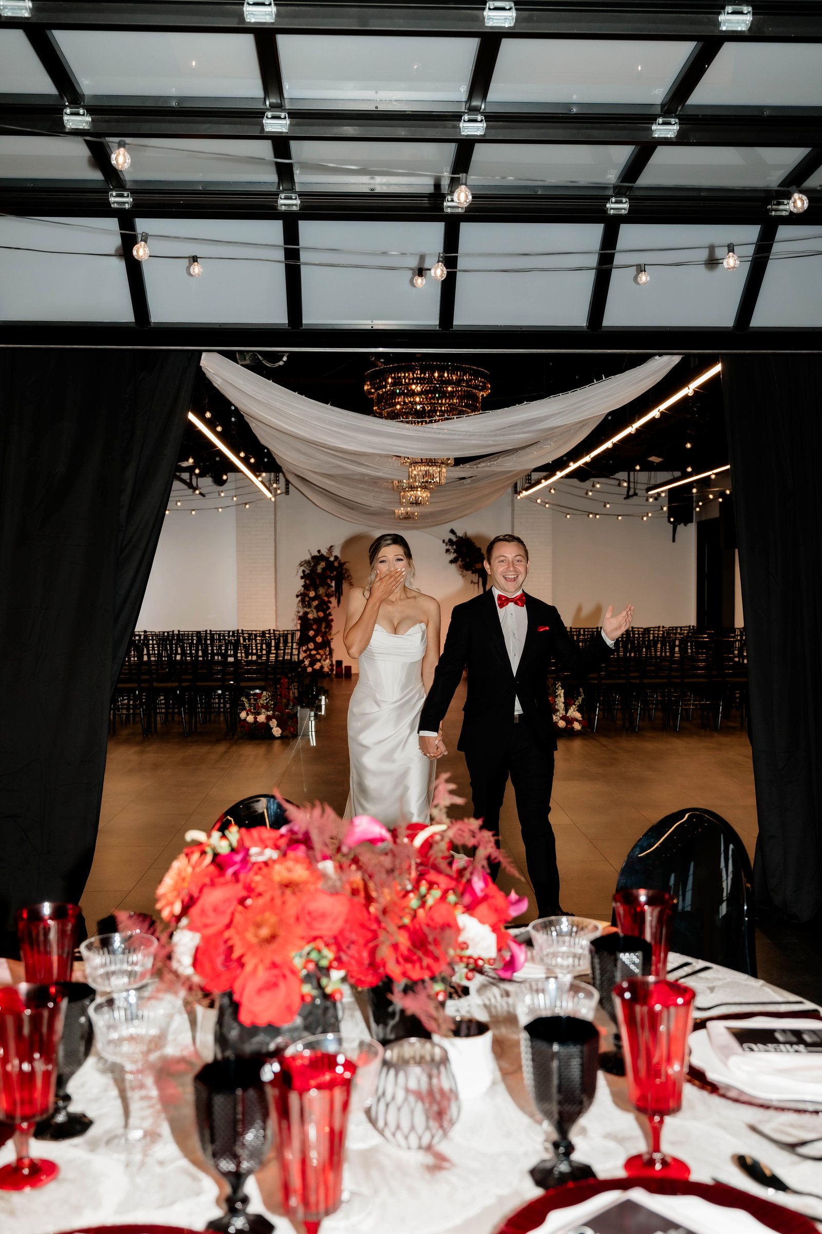 A couple entering their reception at Trellis 925