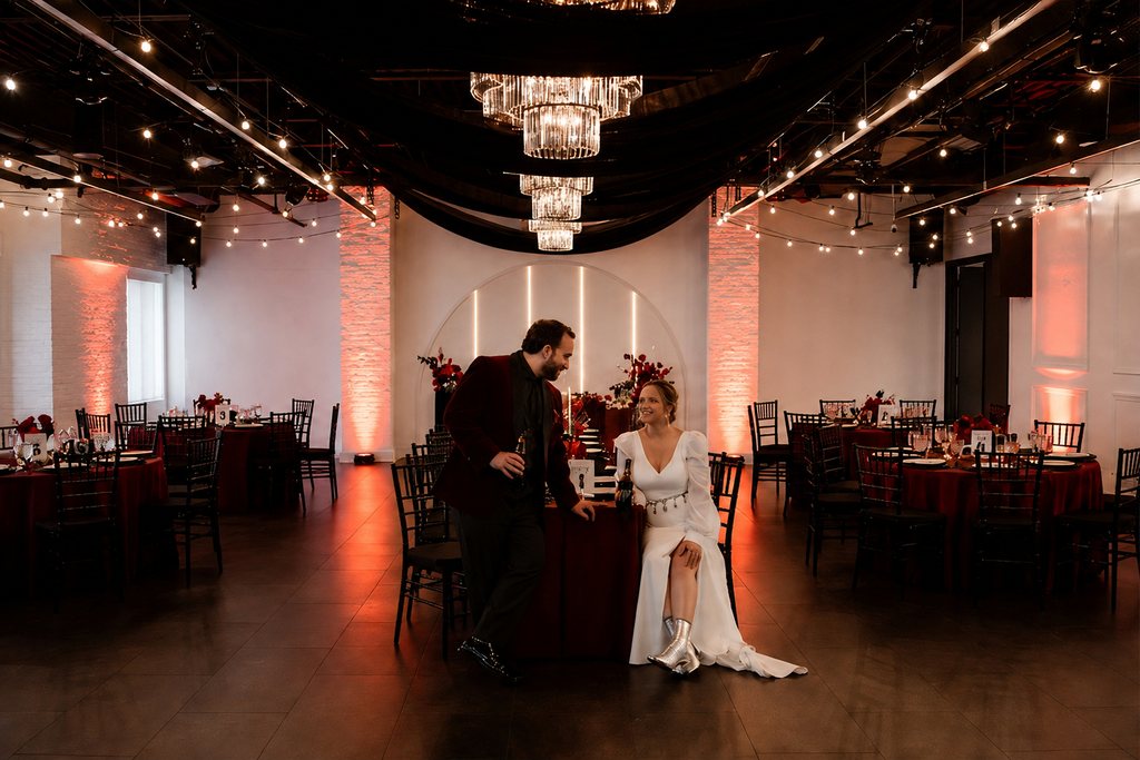 A wedding reception in warm red lighting at Trellis 925